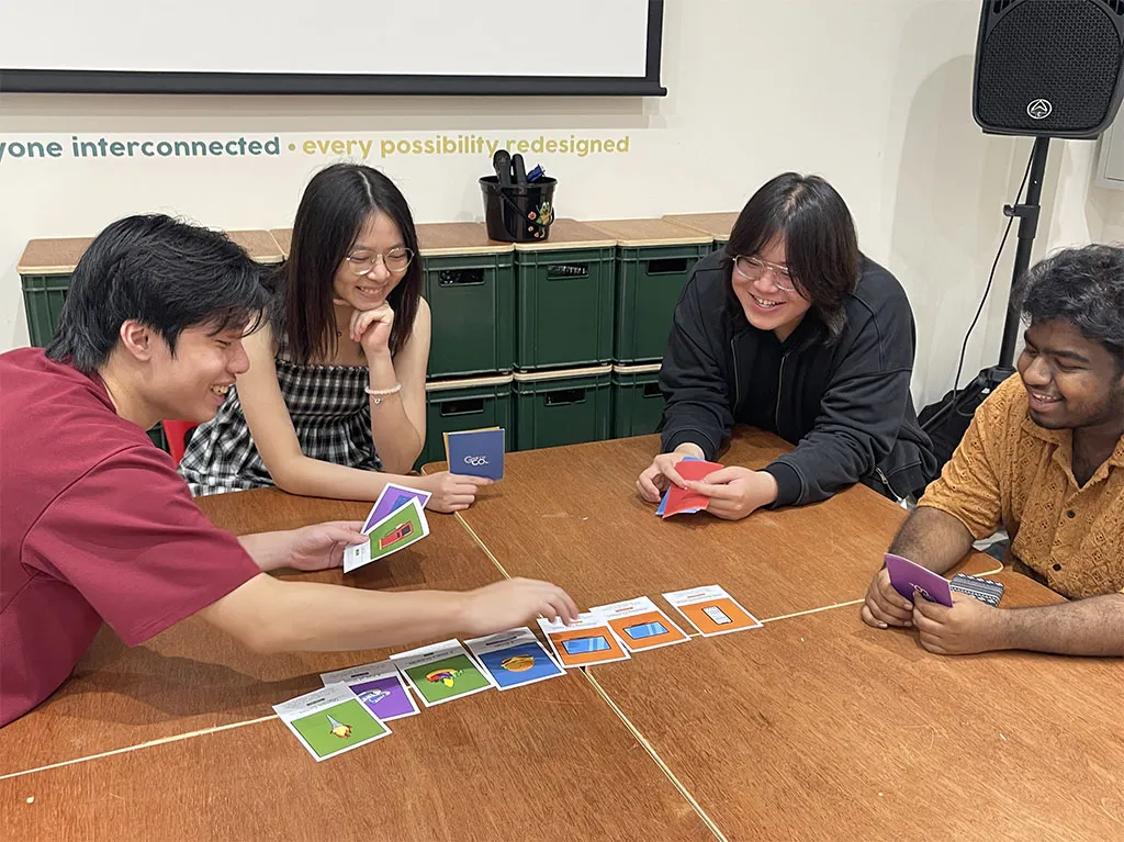 Visitors engaging with gamified CO₂ decision-making game