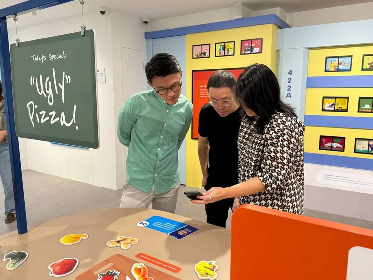 Visitors participating in a hands-on carbon learning activity