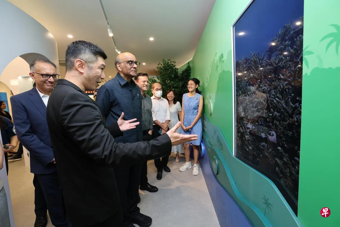 Group touring the Carbon gallery with a guided sustainability educator