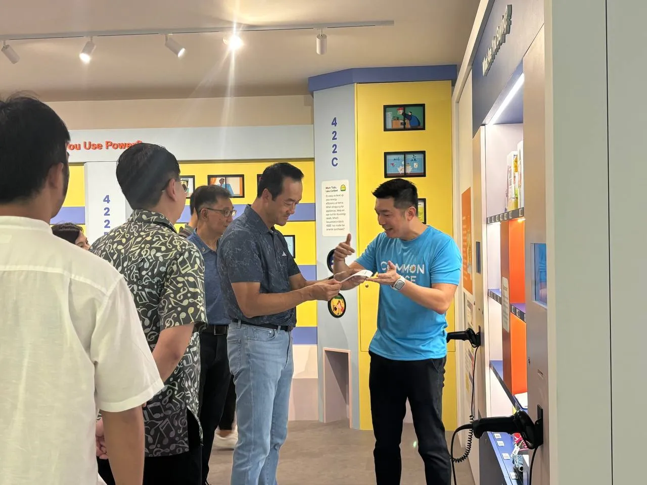 Visitor exploring hands-on sustainability installation