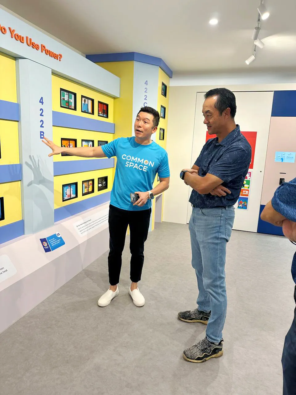 Visitor exploring hands-on sustainability installation
