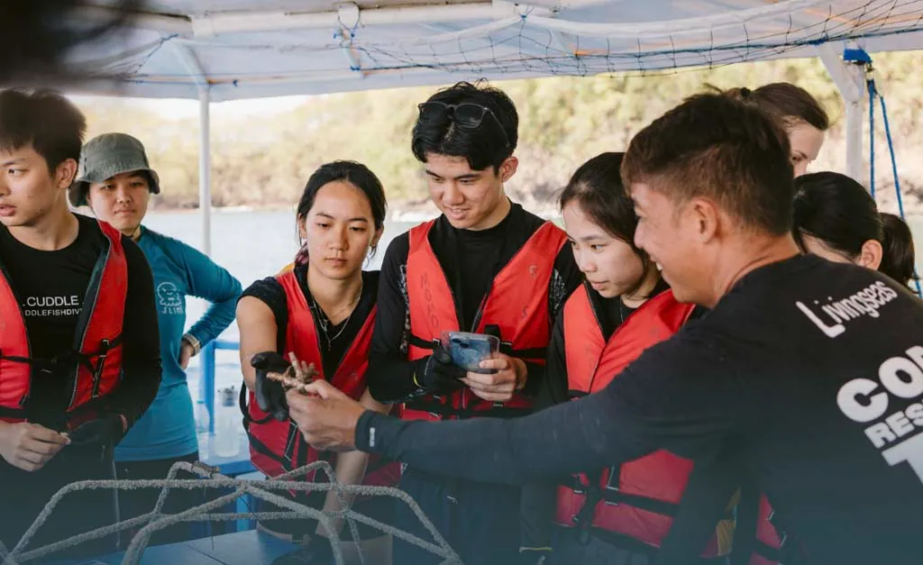 Visitors engaging with gamified CO₂ decision-making game