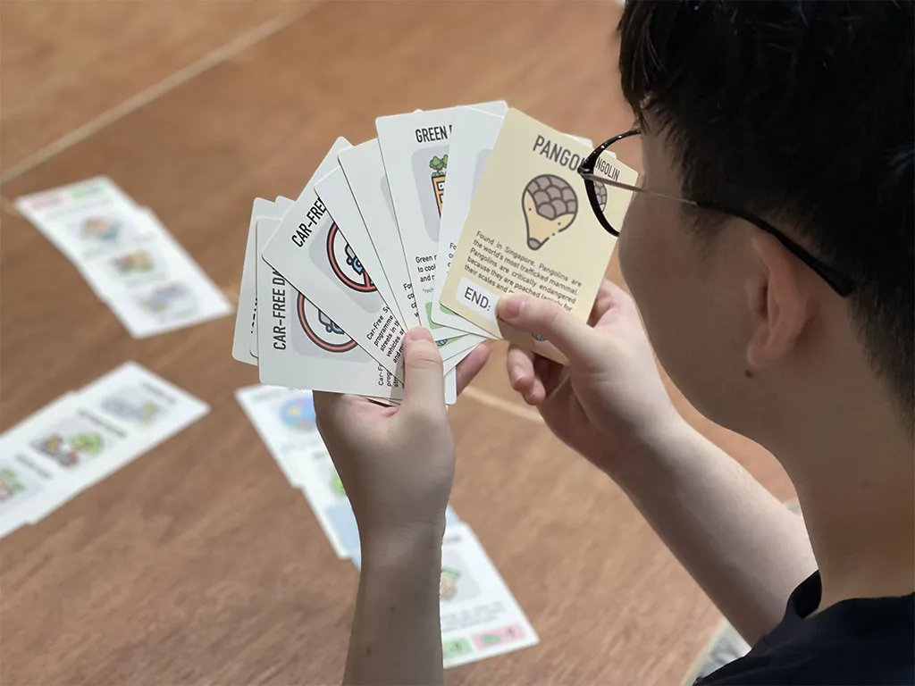 Visitors engaging with gamified CO₂ decision-making game