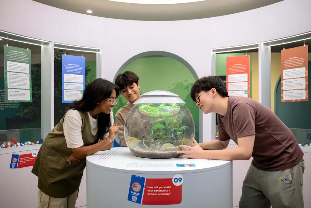 Guests learning from interactive carbon displays during their visit