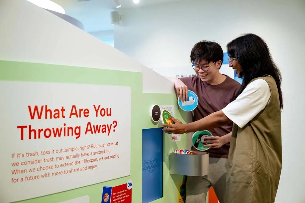 Visitors participating in a hands-on carbon learning activity