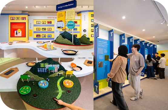 Visitor exploring hands-on sustainability installation