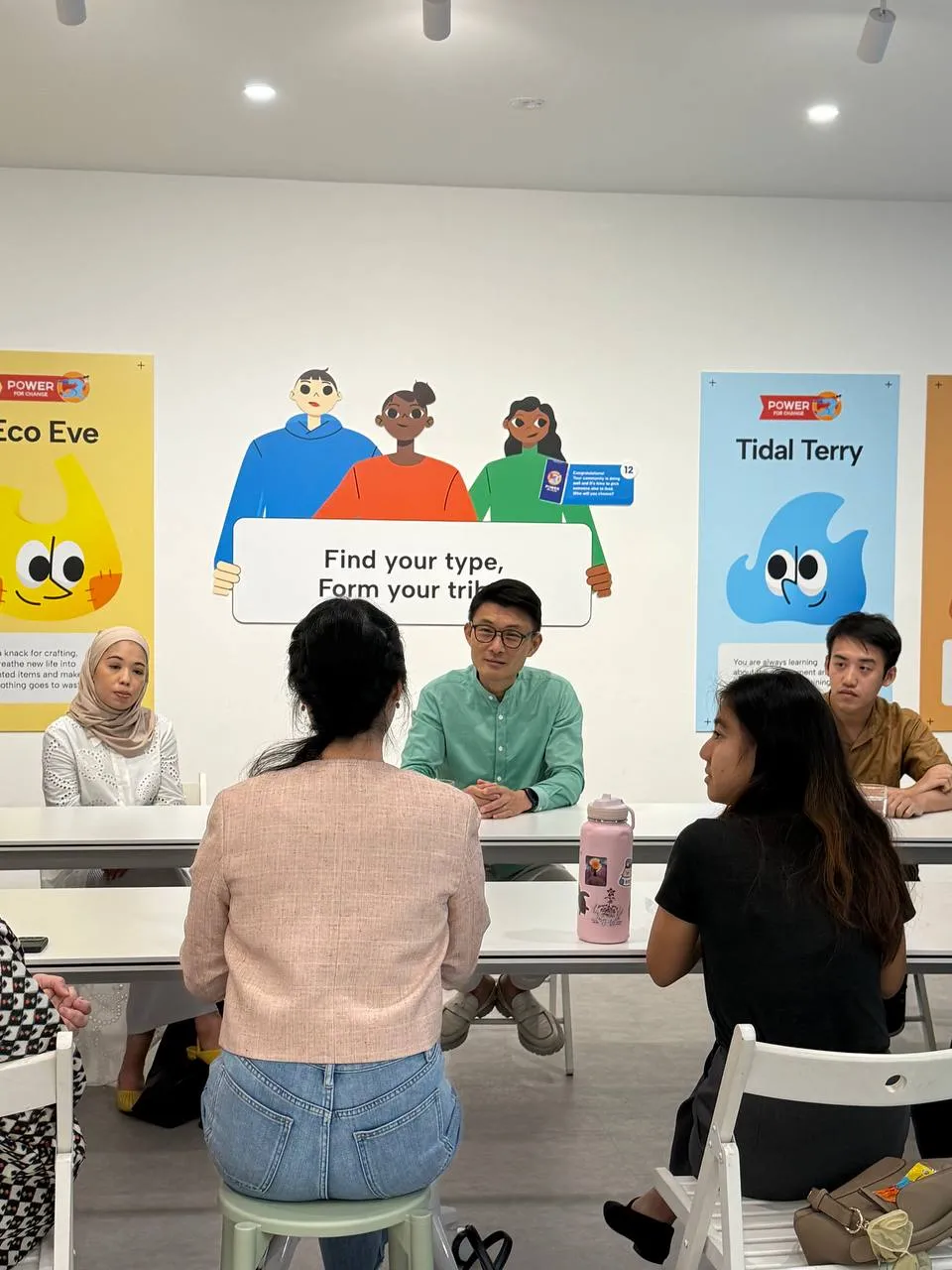 Visitors participating in a hands-on carbon learning activity at Carbon Gallery
